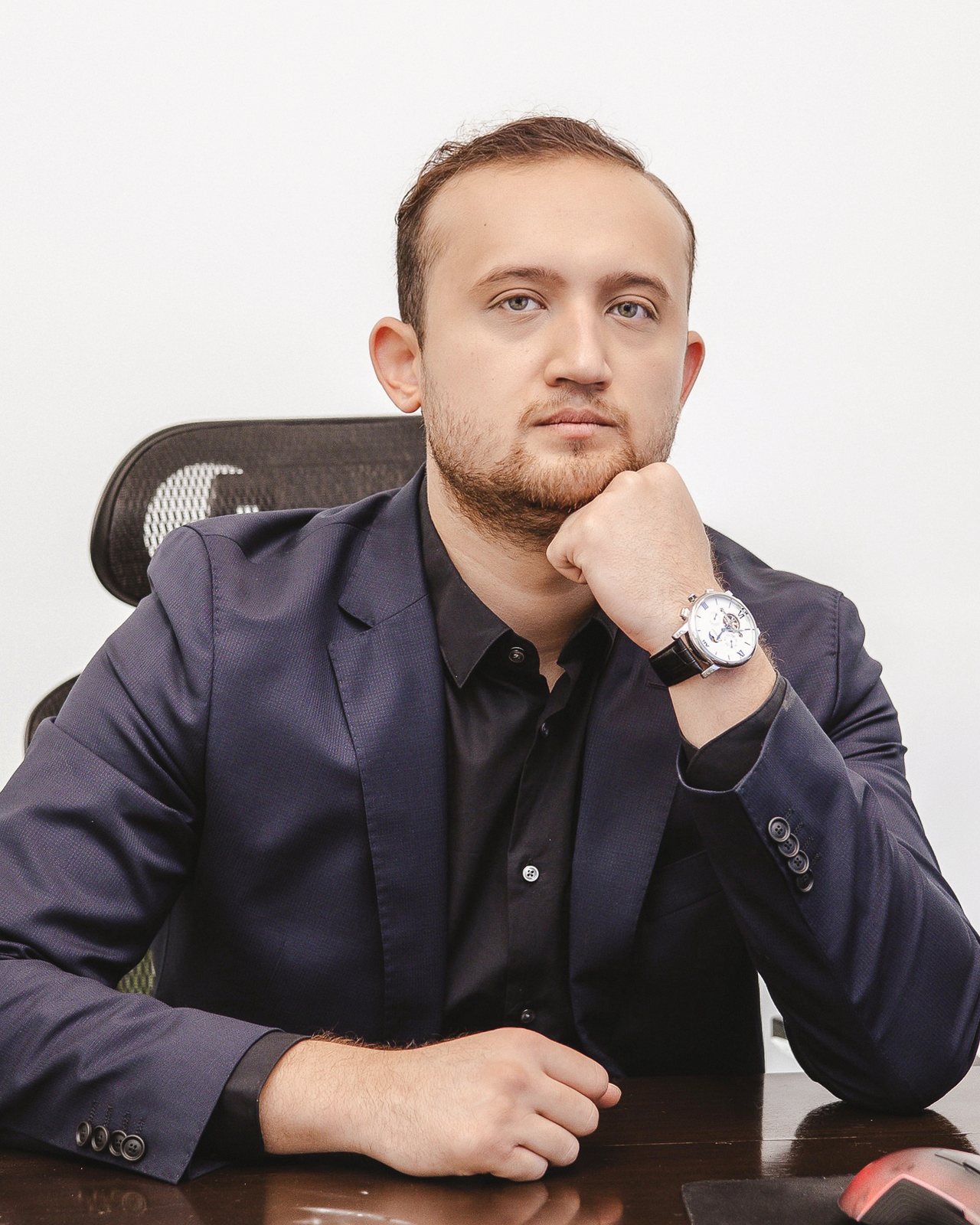 Shakh Kadirov at his desk in the Hallandale Beach office.