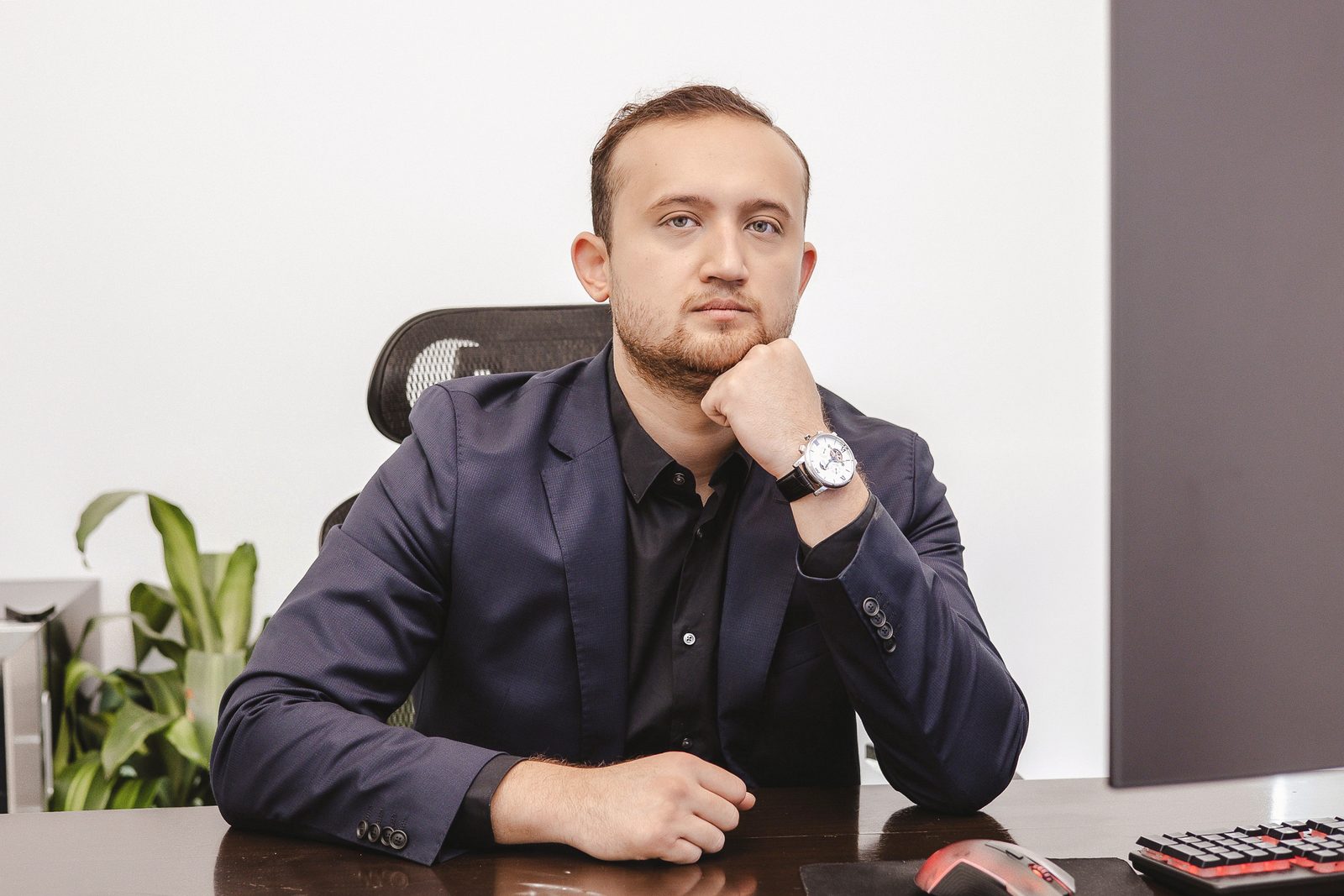 Shakh Kadirov at his desk in the Hallandale Beach office.