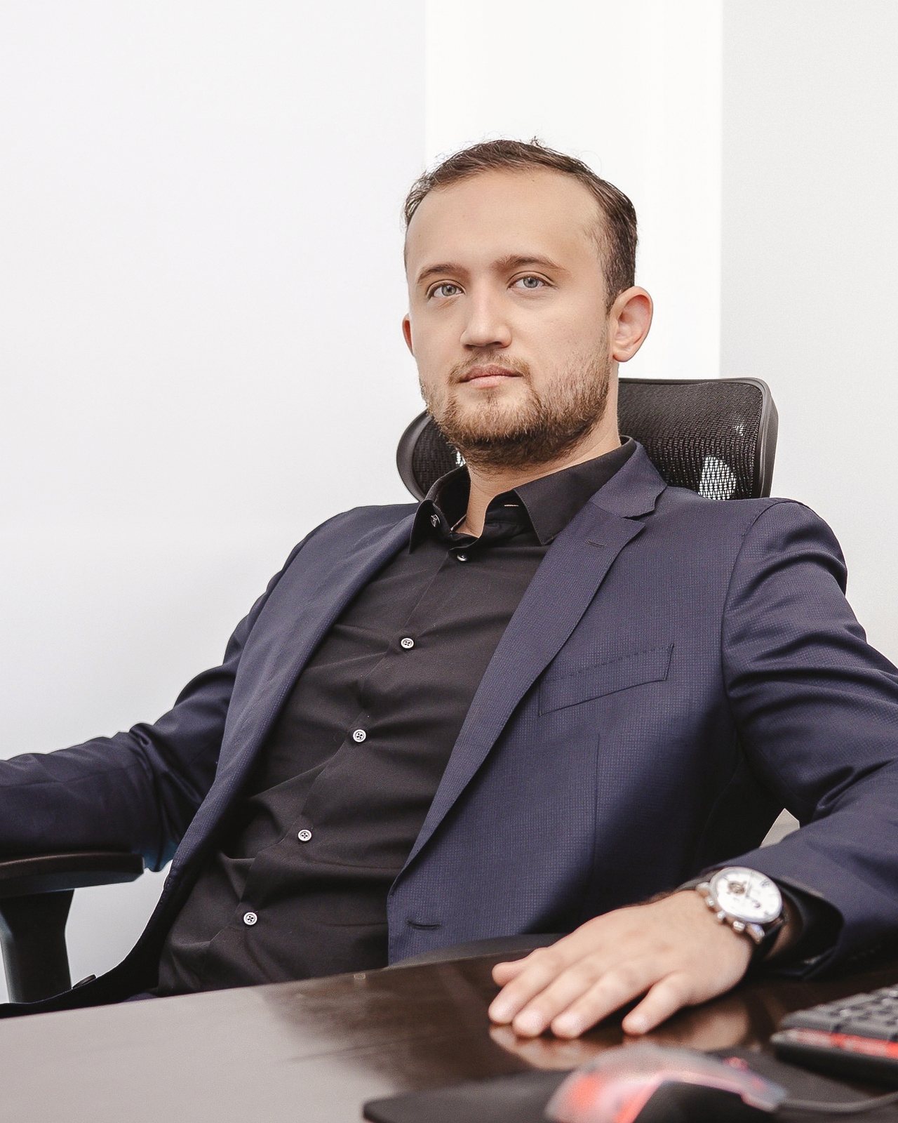 Shakh Kadirov at his desk in the Hallandale Beach office.